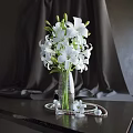 Beautiful White Lilies in Textured Glass Vase with Pearl Decor on Dark Table
