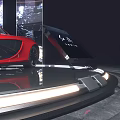 Modern Display Showcase Featuring Red Sports Car And Circular Lighting Design