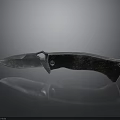 Folding Knife With Sharp Metal Blade And Black Handle On Dark Reflective Surface