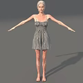 Woman in black and white checkered dress with arms outstretched standing against gray background barefoot