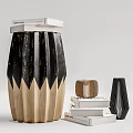 Black And Beige Wooden Stool With Unique Striped Design And Stack Of Books Nearby