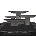 Tiered Fountain With Cascading Water Streams And Reflective Pool Base Design