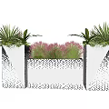 Modern Geometric Patterned Flower Planters With Green Plants And Pink Flowers