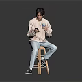 Man Sitting On Wooden Stool Holding Phone And Blue Cup In Light Sweater