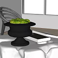 Decorative Black Potted Bonsai With Green Moss On Indoor Table And Books