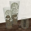 Decorative Ornament Set with Clear Glass Containers Dried Flowers Pebbles and Black Candles on Wooden Tabletop