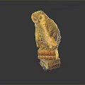 Detailed Brown Owl Statue Perched on a Stack of Old Books