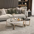 Round Marble Top Coffee Table with Gold Frame and Decorative Items in Modern Living Room