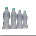 Beverage in Transparent Plastic Bottles with Blue Labels and Green Caps Neatly Arranged in Groups