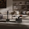 Round Blue Marble Coffee Tables With Silver Ribbed Bases And Decorative Figurine Plant Fruit Plate