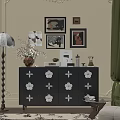 Black Console Cabinet With White Flower Patterns Decorative Vase Framed Art And Books On Top