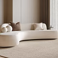 Beige Curved Sofa with Brown Cream Pillows on Light Rug Light Walls Window Blinds