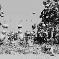 Vibrant Garden With Colorful Flowers Green Grass Decorative Ant Sculptures Trees And Bird