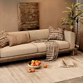 Two Seater Beige Sofa With Patterned Cushions Knitted Throw Green Plant And Decorative Rug