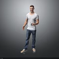 Man in Gray T-Shirt and Blue Jeans Holding White Cup Standing Against Simple Gray Background