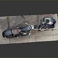 Vintage Black Motorcycle With Brown Seat On Stone Pavement And Covered Cloth