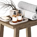Bathroom Daily Wash Essentials On Wooden Stool With Towels Soap Bottles