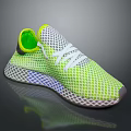 Neon Green Mesh Sneakers With White Laces And Structured Sole Design