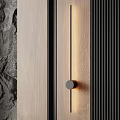 Contemporary Linear Wall Sconce with Warm Light on Wooden Stone Textured Interior Wall