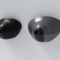 Round Shape Black and Silver Security Cameras Mounted on White Wall