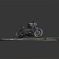 Black Cruiser Motorcycle With Red Accents On Gray Stone Pavement