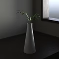 White Conical Vase With Green Leaves On Dark Wooden Tabletop Against Gray Wall And Window