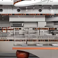 Modern Dessert Shop Interior Featuring Open Kitchen Orange Decor Glass Display Cases And Metallic Elements 3d model