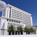 Modern Office Building With White Facade And Large Windows Under Blue Sky And Trees