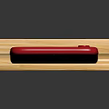 Red Mobile Phone Placed on Wooden Stand with Screen Showing Multiple App Icons