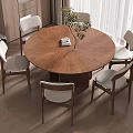Modern Interior With Round Wooden Dining Table Four Chairs And Potted Plant