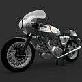 Vintage Silver Motorcycle Featuring Classic Windshield Black Wheels and Golden Accents