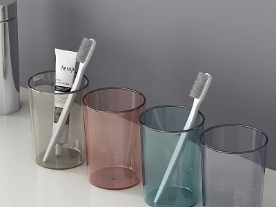 Modern Bathroom Accessories With Assorted Color Tumblers Toothbrushes And Toothpaste On White Countertop 3d model