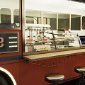 Vintage Food Truck Restaurant With Outdoor Seating Tables Chairs And Umbrella