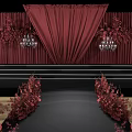 Elegant Wedding Stage Setup With Red Curtains Floral Arrangements And Chandeliers