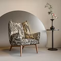 Stylish Patterned Accent Chair With Floral Vase On Side Table And Curved Metal Wall