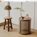 Round Wooden Side Table With Woven Rattan Design Green Plant And Decorative Figurine