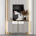 Modern Entryway Side Cabinet With Striped Doors Golden Trim And Decorative Artwork