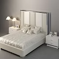 Modern White Double Bed With Mirrored Headboard Pillows Nightstands Table Lamps And Photo Frames