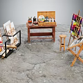 Musical Instruments and Art Supplies with Easels Canvases Paints Brushes and Wooden Table