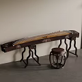 Traditional Chinese Guzheng with Carved Wooden Body Placed Against Wall With Wooden Drum Stool