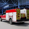 Ford Heavy Duty Fire Truck With Red And White Exterior In Garage Setting