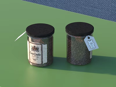 Two Glass Spice Jars With Black Lids And Labeled Tags On Green Countertop 3d model