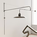 Modern Adjustable Metal Arm Wall Lamp With Sleek Design On Neutral Interior Wall