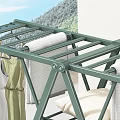 Green Foldable Clothes Drying Rack With Hanging Dresses And Shirts Indoor