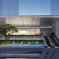 Modern Building Facade With Metal Canopy Glass Curtain Wall Green Wall Water Fountain And Escalator