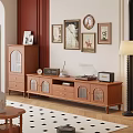 Wooden TV Stand Featuring Record Player Radio Clock and Wall Art in Cozy Vintage Room
