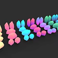 Various Colorful Abstract Decorative Objects Arranged In Row On Black Background