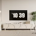 Modern Light Colored TV Stand In Living Room With Decorative Items And Green Plant