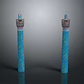 Two Blue Decorative Columns With Intricate Patterns And Ornamental Tops