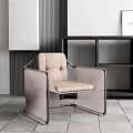 Modern Leisure Chair With Beige Cushion And Metal Frame By Bookshelf In Interior